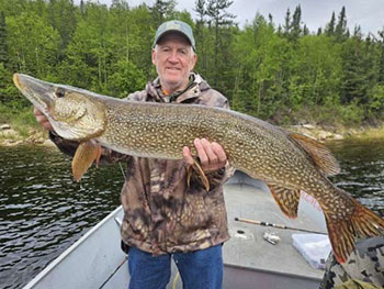 Man holding large fish 10